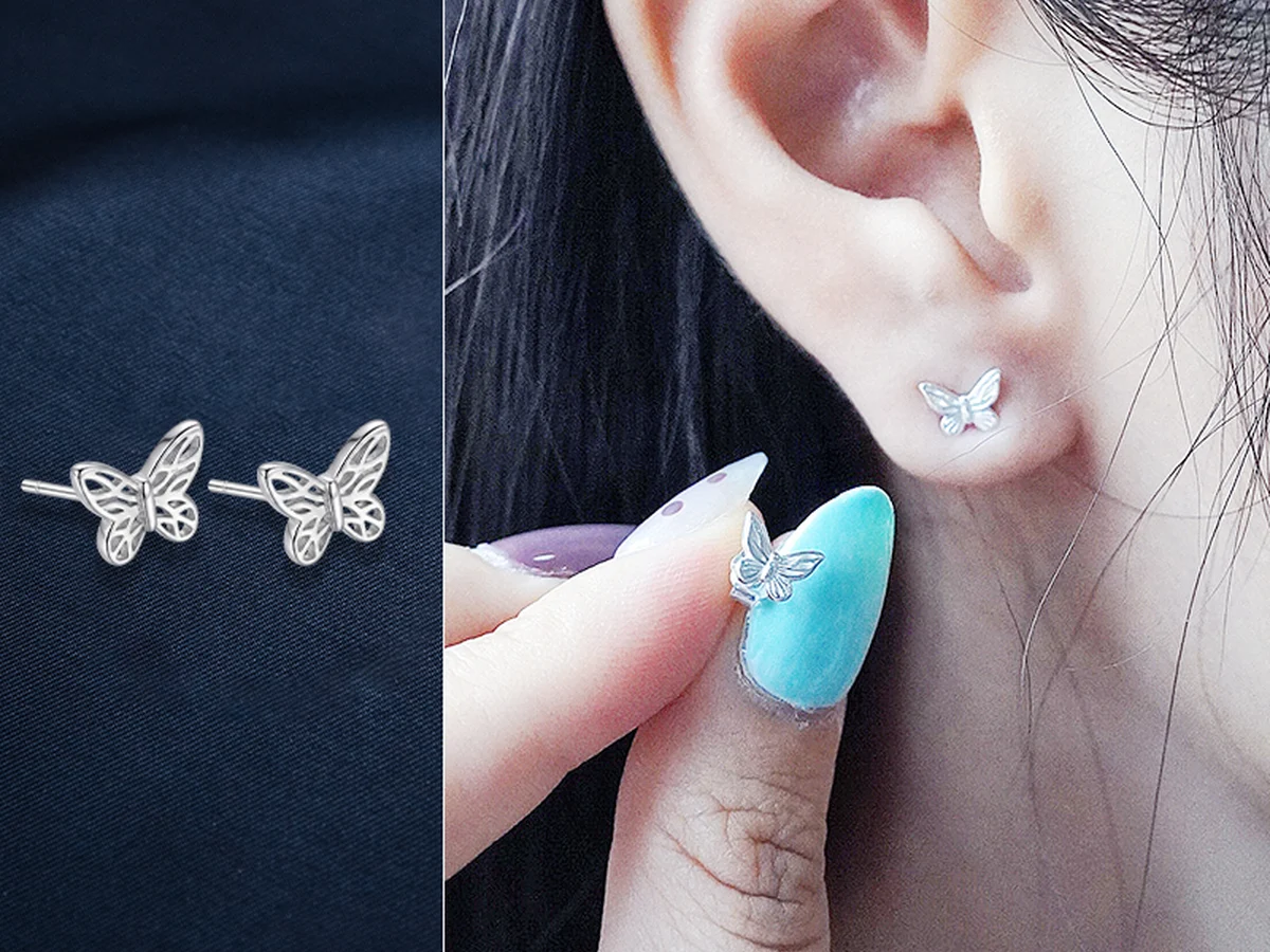 Bông tai bạc dạng xỏ mặt nhỏ hình bướm nằm gọn trên dái tai, không buông thõng